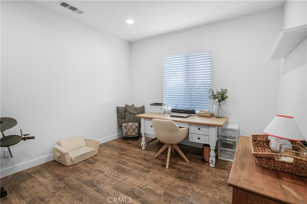 35814 Anderson Street Beaumont, CA 92223 - Photo 11 of 75 a view of a dining room with furniture window and wooden floor