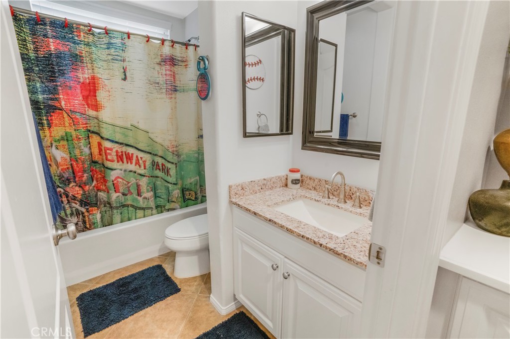 35814 Anderson Street Beaumont, CA 92223 - Photo 17 of 75 a bathroom with a granite countertop sink mirror vanity and toilet