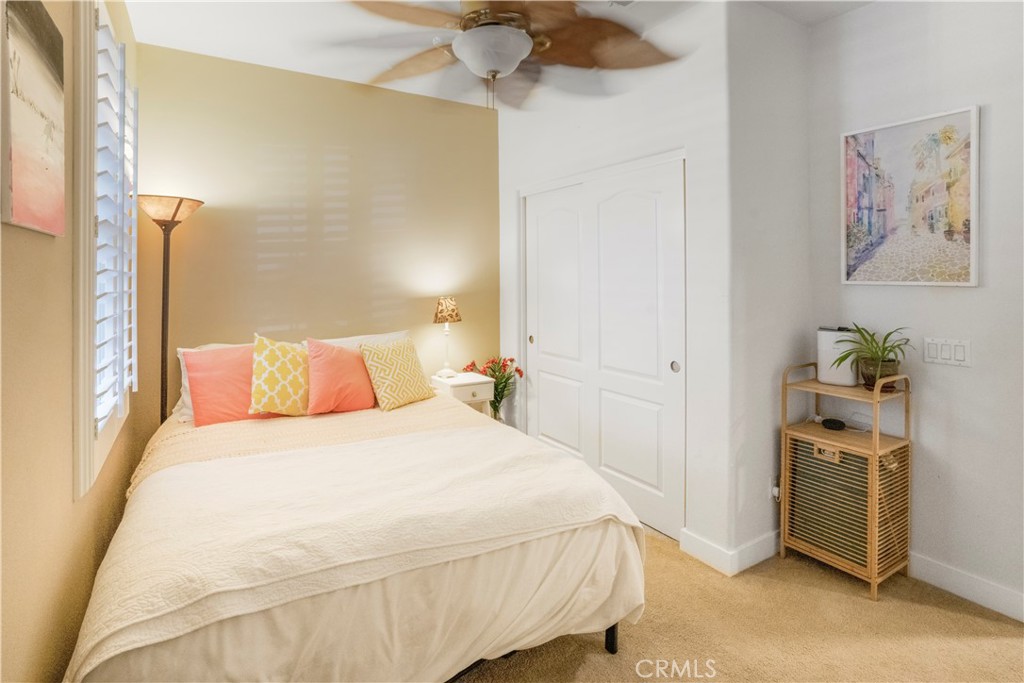 35814 Anderson Street Beaumont, CA 92223 - Photo 22 of 75 a bedroom with a bed dresser and a picture on the wall