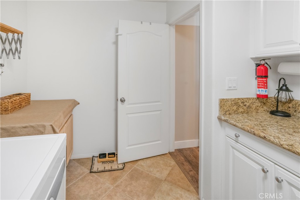 35814 Anderson Street Beaumont, CA 92223 - Photo 24 of 75 a view of a storage and utility room with washer and dryer
