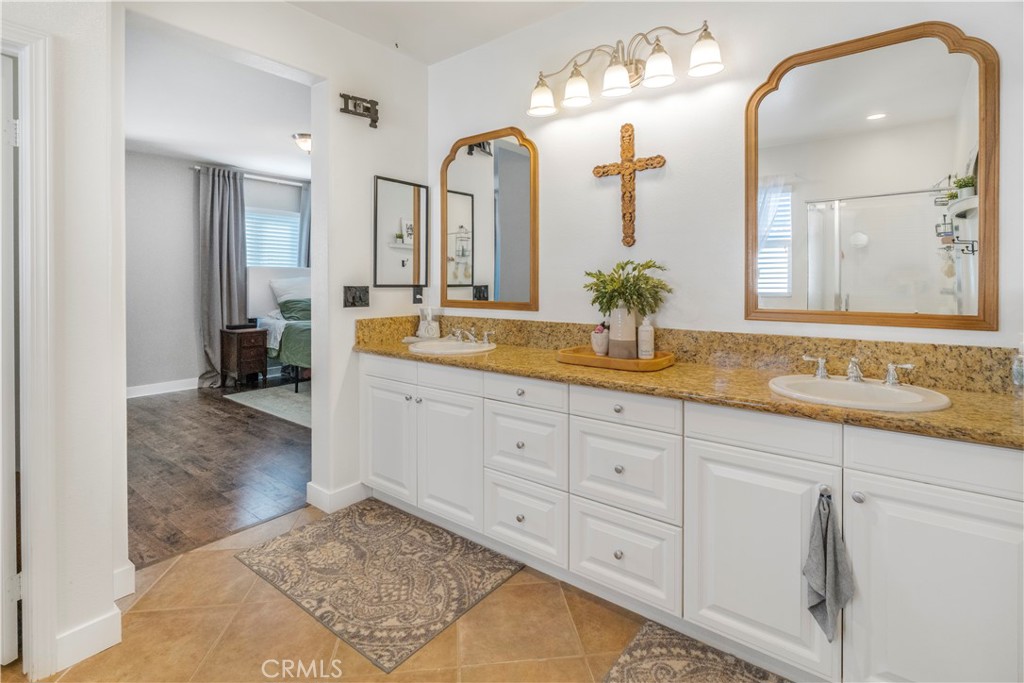 35814 Anderson Street Beaumont, CA 92223 - Photo 32 of 75 a spacious en suite bathroom with double sink and a mirror