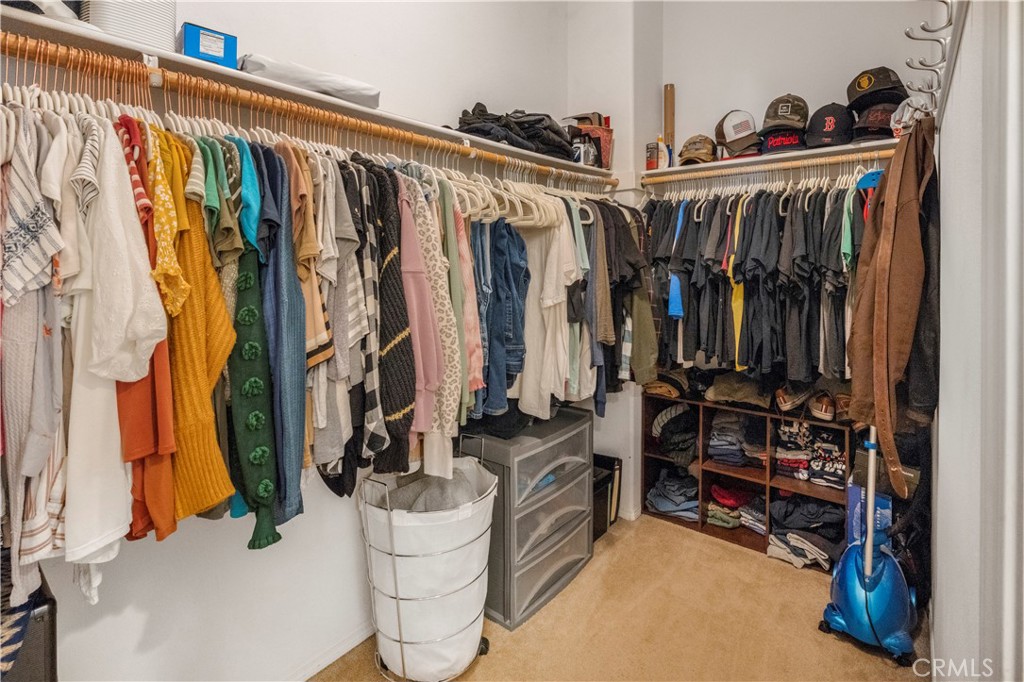 35814 Anderson Street Beaumont, CA 92223 - Photo 34 of 75 a view of walk in closet with clothes and shoes