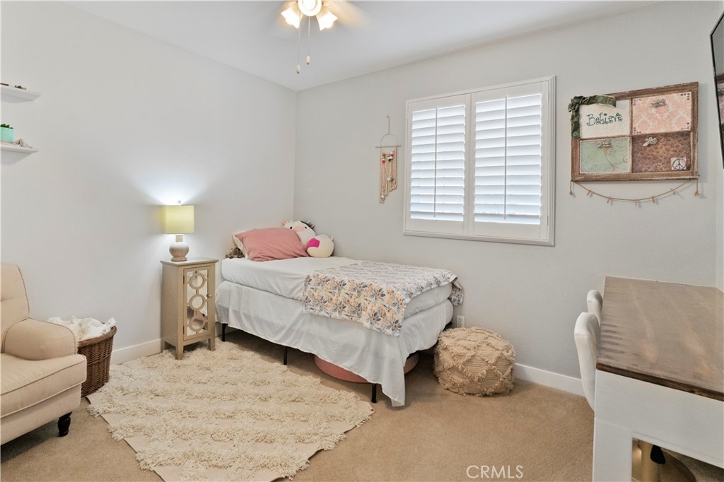 35814 Anderson Street Beaumont, CA 92223 - Photo 38 of 75 a bedroom with a bed and a couch