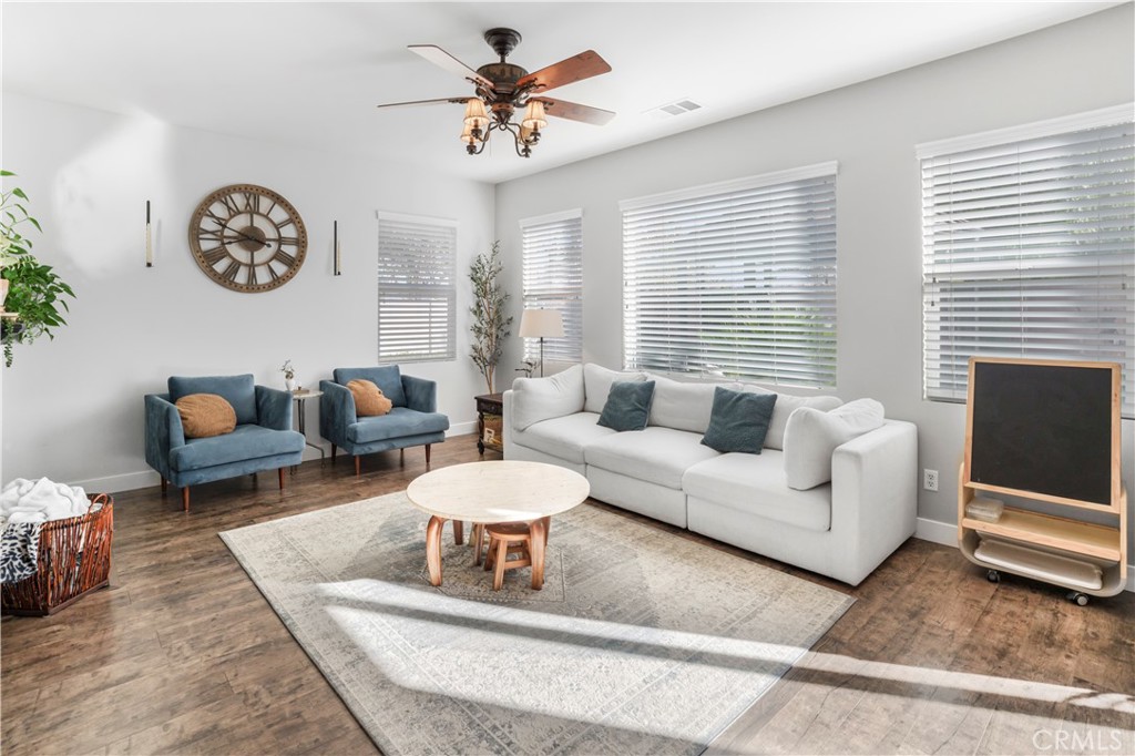 35814 Anderson Street Beaumont, CA 92223 - Photo 4 of 75 a living room with furniture a rug and a window