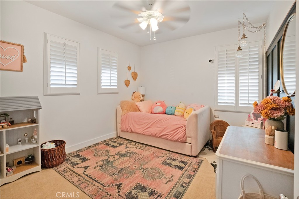 35814 Anderson Street Beaumont, CA 92223 - Photo 42 of 75 a bedroom with a bed and a chandelier