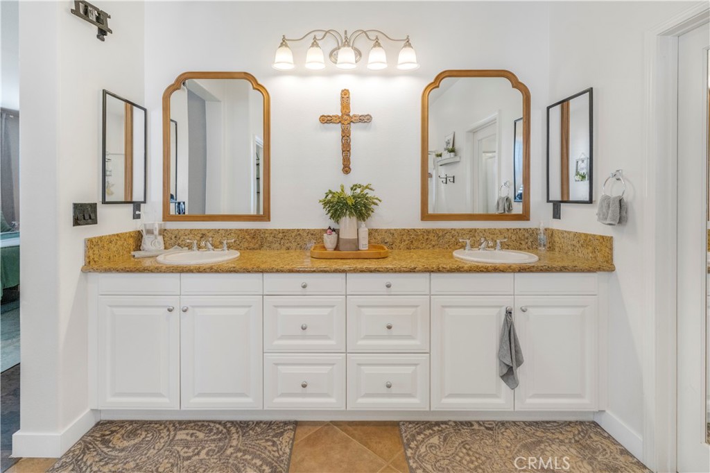 35814 Anderson Street Beaumont, CA 92223 - Photo 47 of 75 a bathroom with sink mirror and vanity