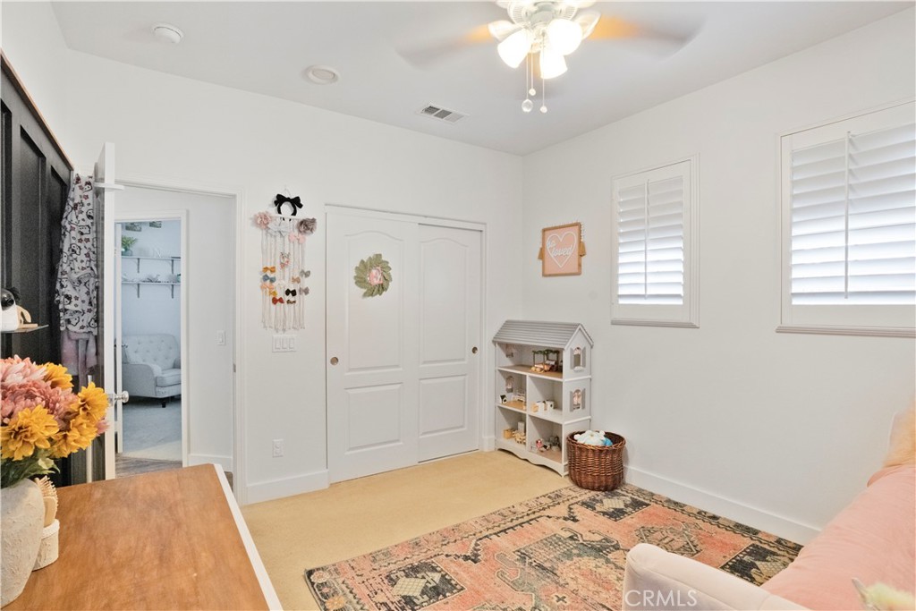 35814 Anderson Street Beaumont, CA 92223 - Photo 49 of 75 a bedroom with a bed and a dresser