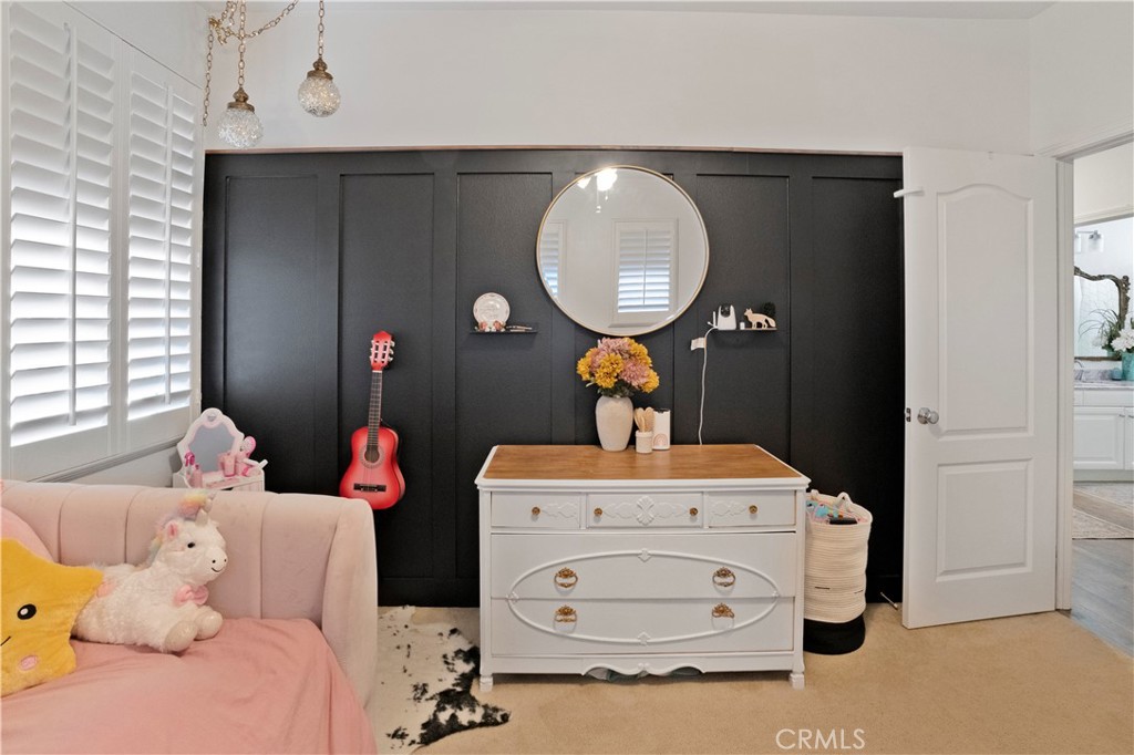 35814 Anderson Street Beaumont, CA 92223 - Photo 50 of 75 a bedroom with a bed and wooden floor