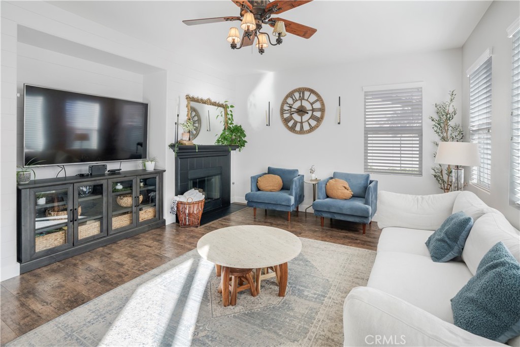 35814 Anderson Street Beaumont, CA 92223 - Photo 5 of 75 a living room with furniture a flat screen tv and a fireplace