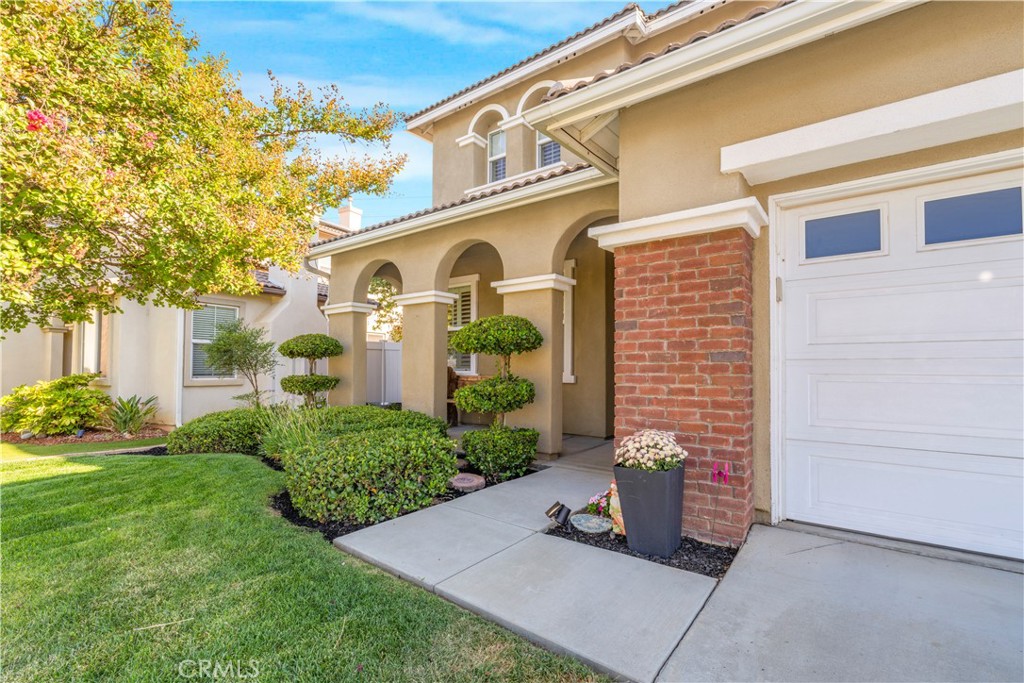 35814 Anderson Street Beaumont, CA 92223 - Photo 61 of 75 a front view of a house with garden
