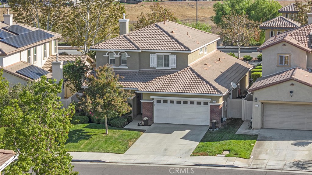 35814 Anderson Street Beaumont, CA 92223 - Photo 73 of 75 a front view of a house with a yard and garage