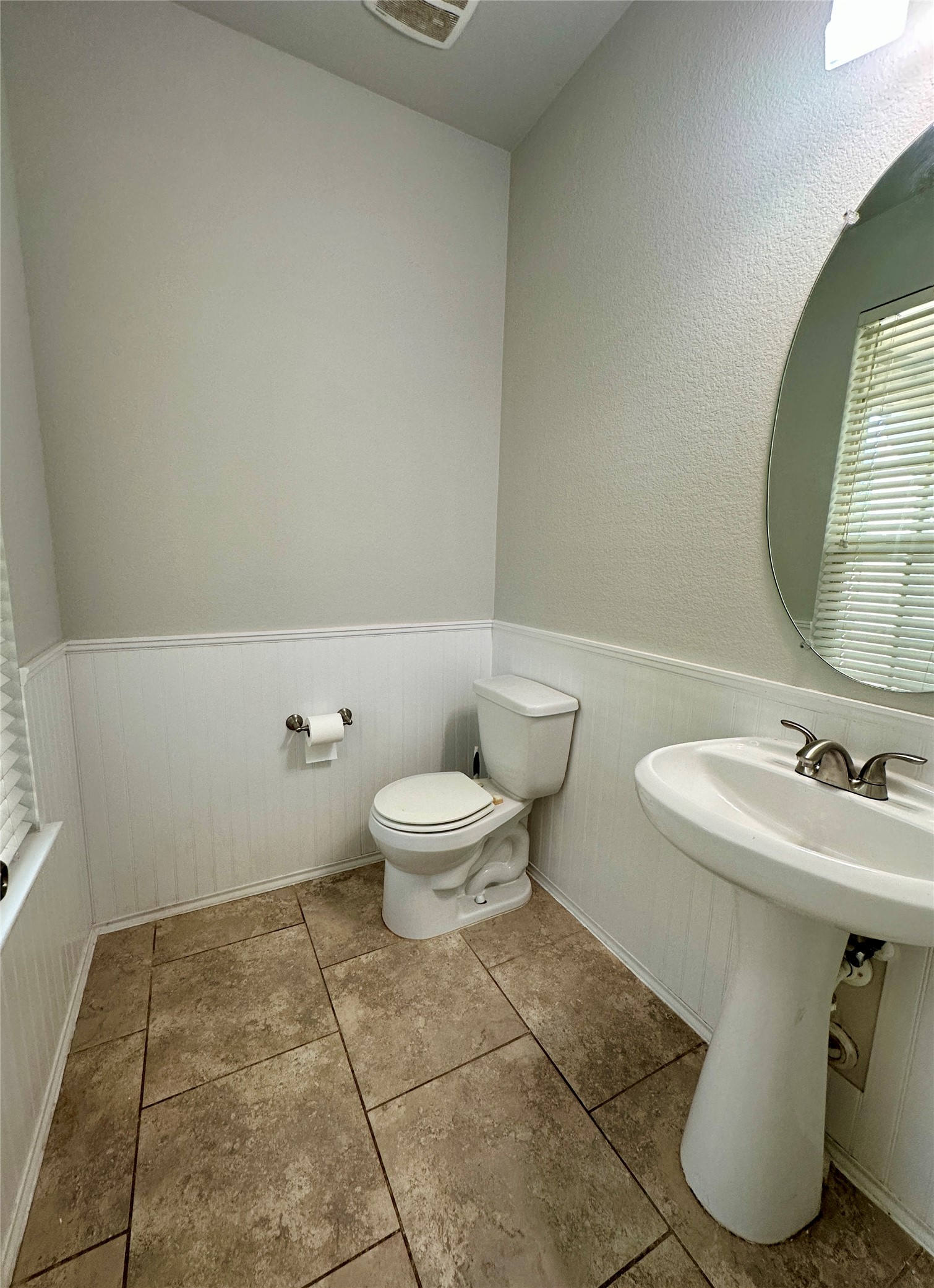 117 Chickadee Lane Leander, TX 78641 - Photo 11 of 24 a bathroom with a toilet sink and mirror