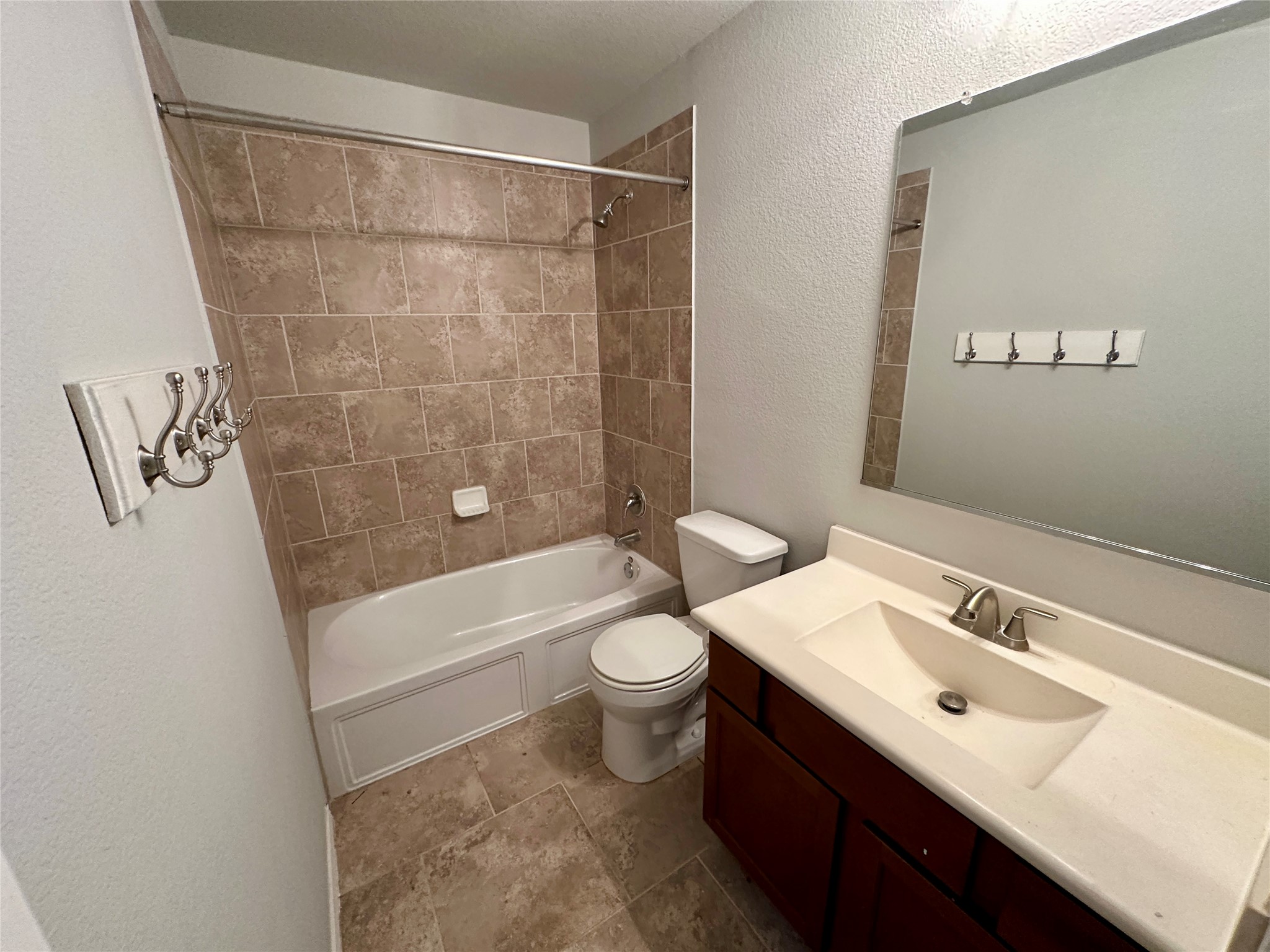 117 Chickadee Lane Leander, TX 78641 - Photo 20 of 24 a bathroom with a sink a toilet and shower