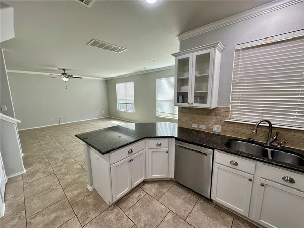 a kitchen with a sink and cabinets