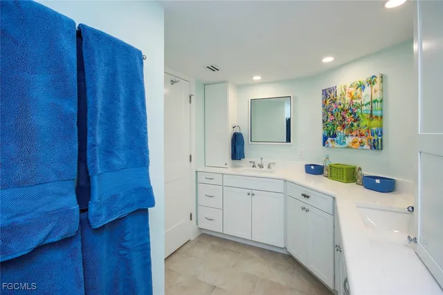 a kitchen with stainless steel appliances a cabinets and a window