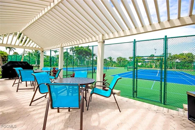 a view of a porch with furniture and yard