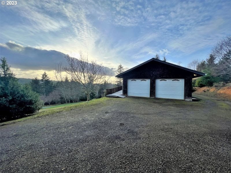 92831 Walluski Loop Astoria, OR 97103 - Photo 13 of 32 a house with trees in the background