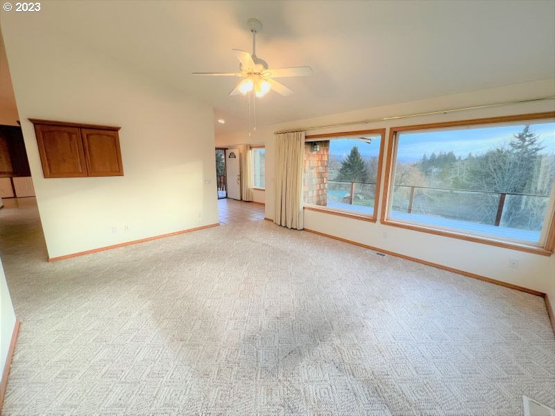 92831 Walluski Loop Astoria, OR 97103 - Photo 19 of 32 a view of a room with large windows
