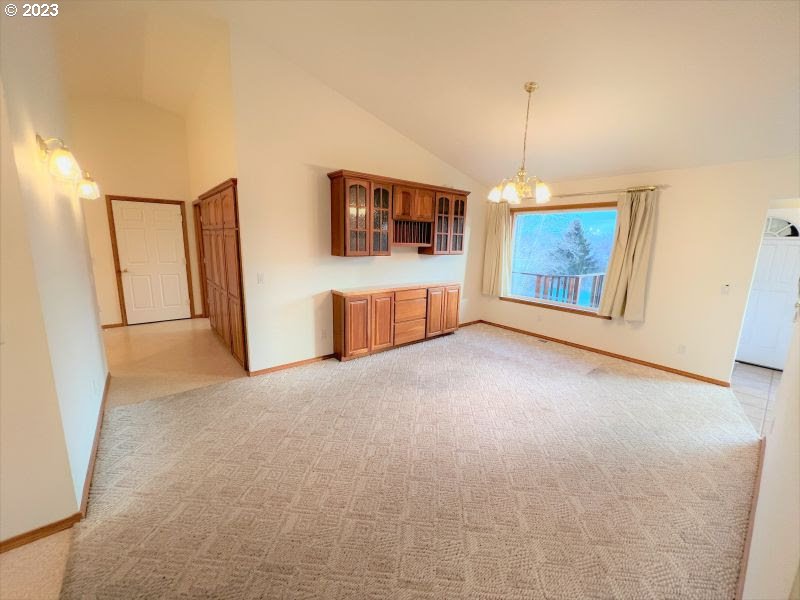 92831 Walluski Loop Astoria, OR 97103 - Photo 20 of 32 a view of an empty room with window and cabinet