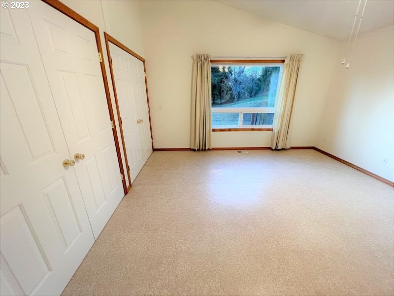 92831 Walluski Loop Astoria, OR 97103 - Photo 25 of 32 an empty room with window