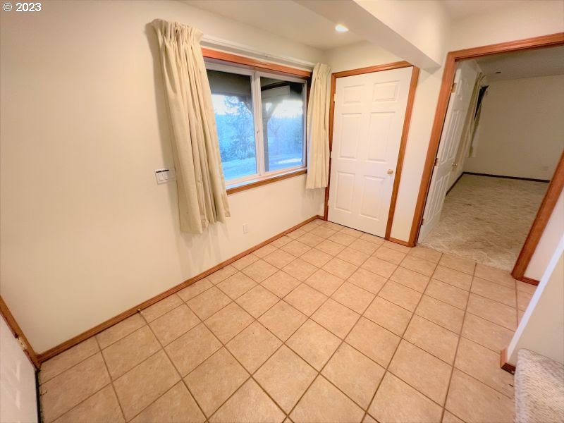 92831 Walluski Loop Astoria, OR 97103 - Photo 28 of 32 a view of an empty room and a window
