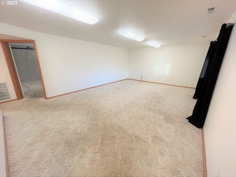 92831 Walluski Loop Astoria, OR 97103 - Photo 29 of 32 an empty room with a empty space