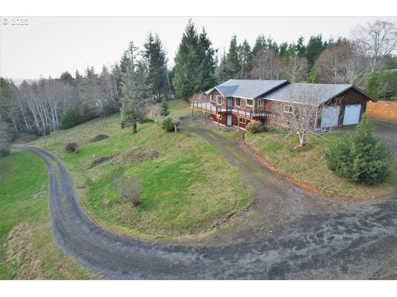 92831 Walluski Loop Astoria, OR 97103 - Photo 4 of 32 a view of a house with a backyard