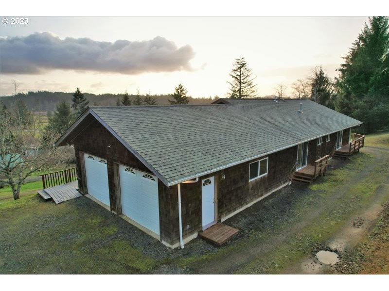 92831 Walluski Loop Astoria, OR 97103 - Photo 7 of 32 aerial view of a house with a yard