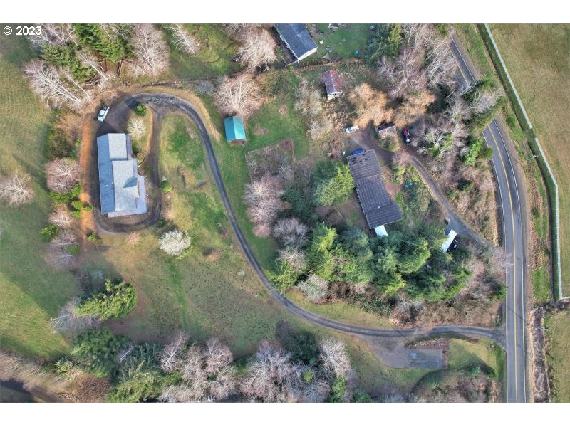 92831 Walluski Loop Astoria, OR 97103 - Photo 8 of 32 an aerial view of waterside residential houses with outdoor space