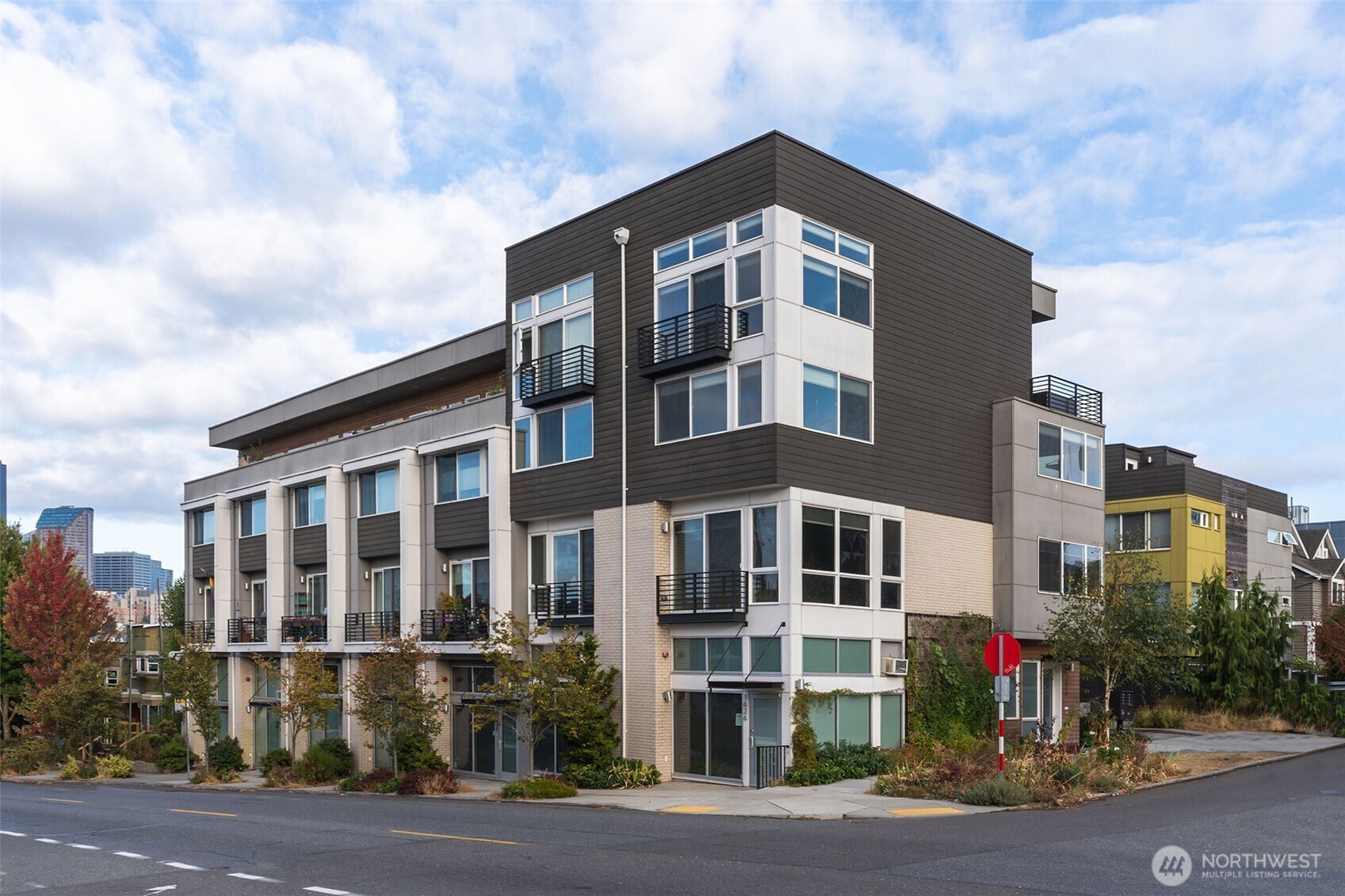 1626 East Yesler Way Seattle, WA 98122 - Photo 1 of 12 a front view of a building with a yard