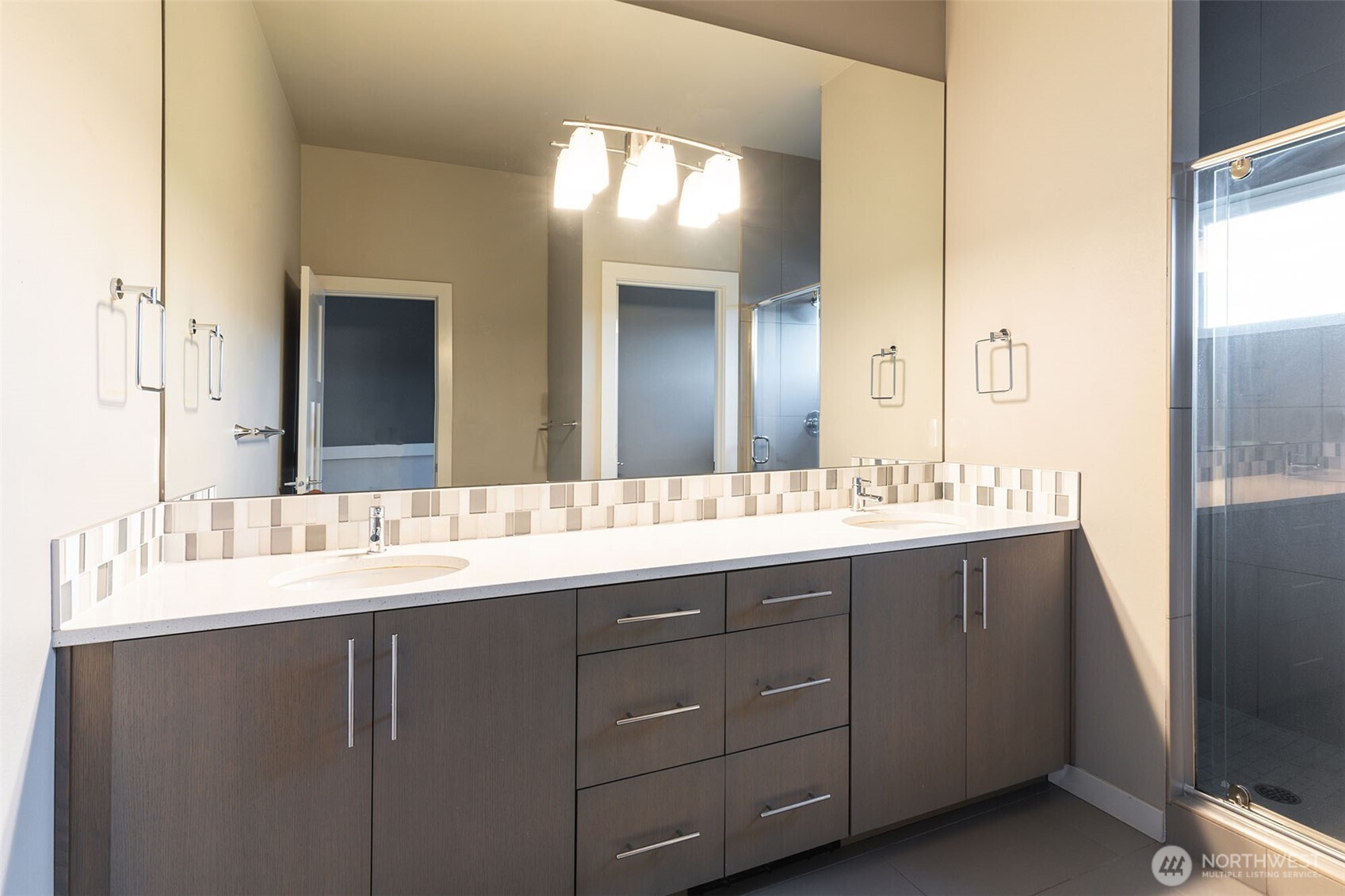 1626 East Yesler Way Seattle, WA 98122 - Photo 11 of 12 a bathroom with a double vanity sink and a mirror