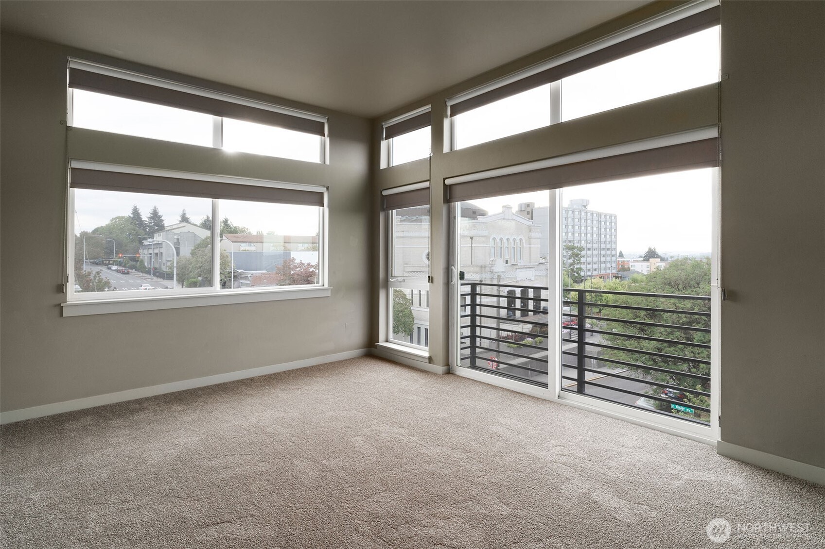 1626 East Yesler Way Seattle, WA 98122 - Photo 10 of 12 a view of an empty room with windows