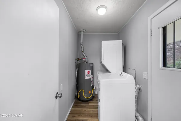 a view of a kitchen from a hallway