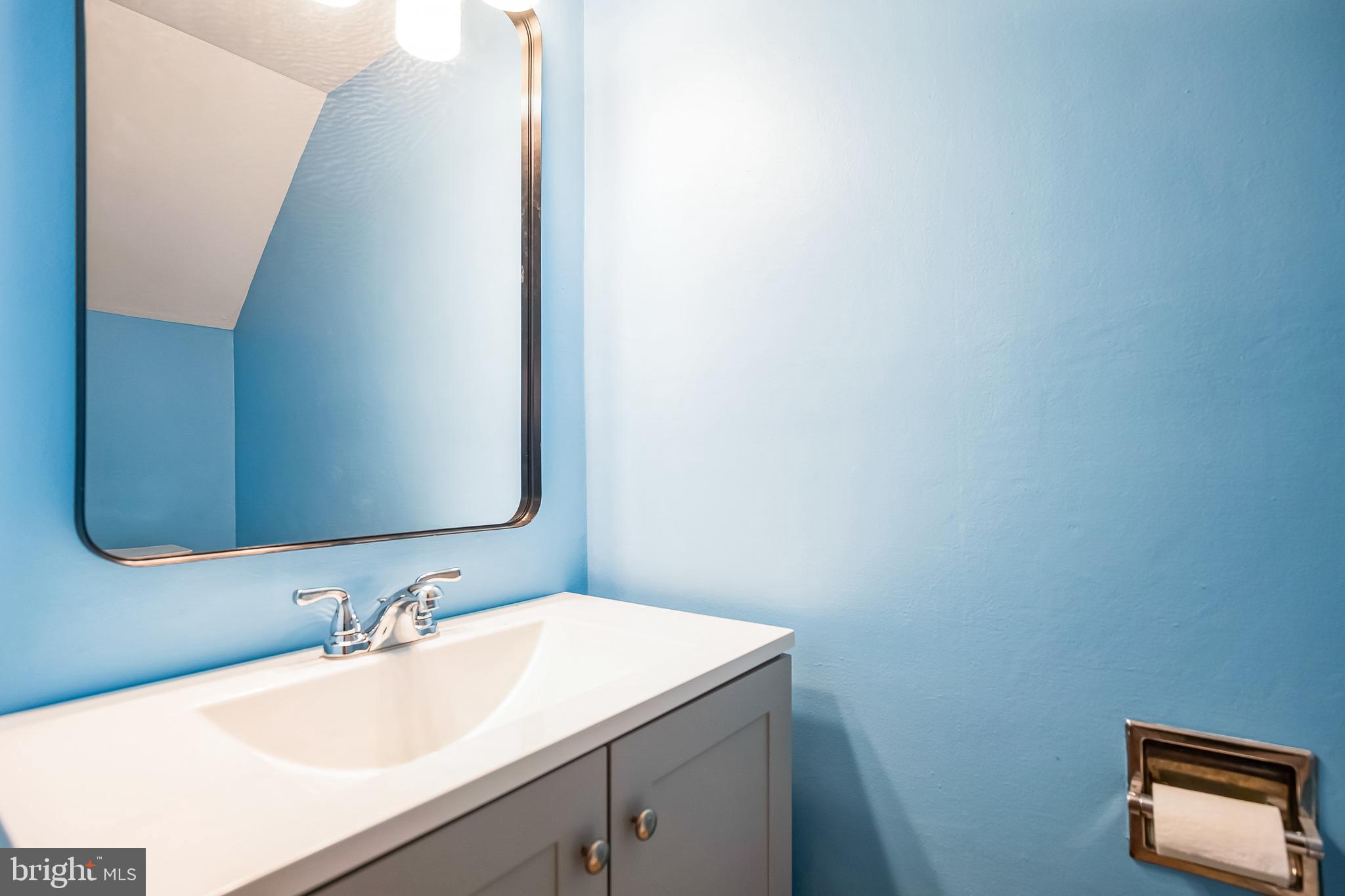 29 Maureen Court Sicklerville, NJ 08081 - Photo 5 of 14 a bathroom with a sink and a mirror