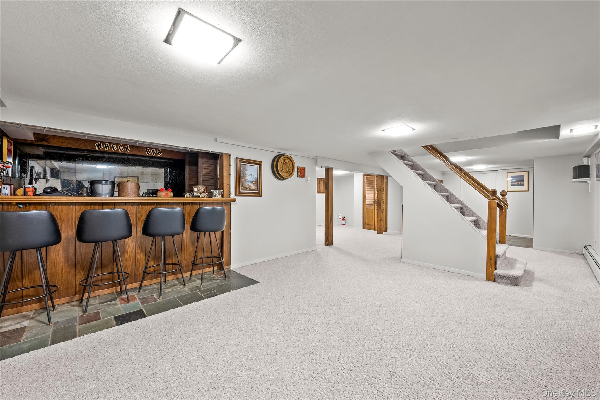 54 Edgewood Road Port Washington, NY 11050 - Photo 20 of 25 Finished Basement for Recreational use only, laundry in the basement