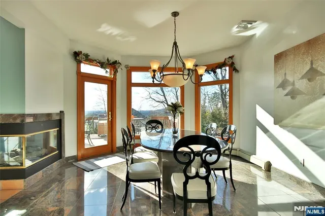 a view of a dining room with furniture window and outside view