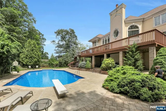 a view of a house with swimming pool