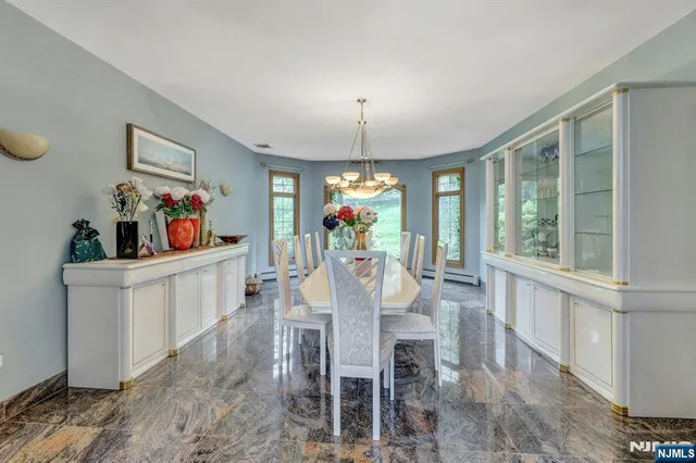 a view of a dining room with furniture window and outside view
