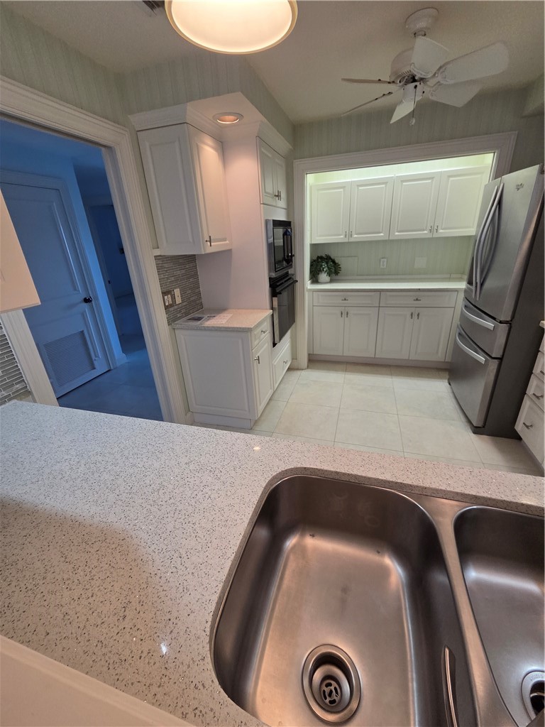 1903 Bay Road, Unit 206 Vero Beach, FL 32963 - Photo 20 of 30 a view of kitchen