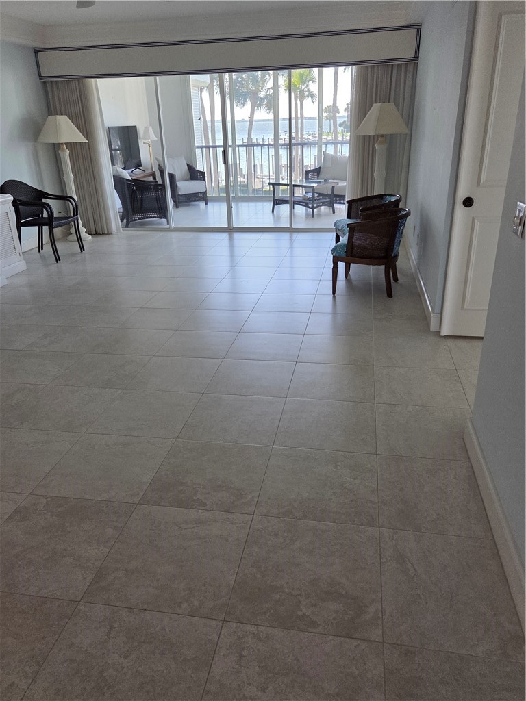 1903 Bay Road, Unit 206 Vero Beach, FL 32963 - Photo 22 of 30 a lobby with furniture and rug
