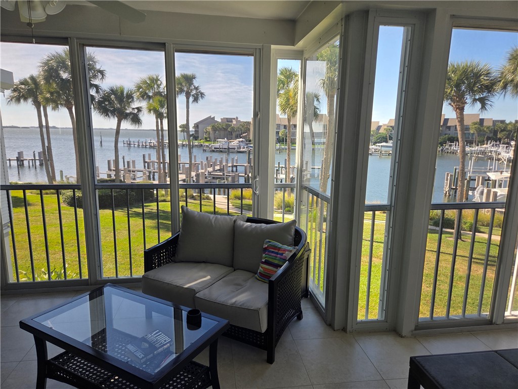 1903 Bay Road, Unit 206 Vero Beach, FL 32963 - Photo 26 of 30 a living room with furniture and a floor to ceiling window