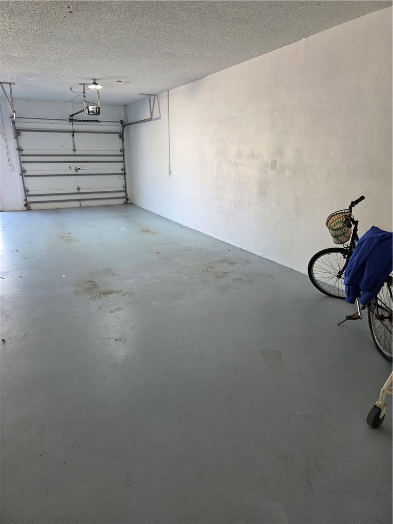 1903 Bay Road, Unit 206 Vero Beach, FL 32963 - Photo 29 of 30 a view of a room with stairs and a ceiling fan