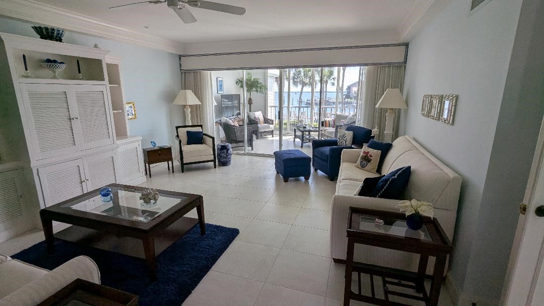 1903 Bay Road, Unit 206 Vero Beach, FL 32963 - Photo 7 of 30 a living room with furniture and a floor to ceiling window