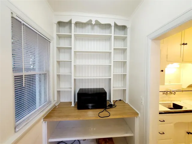 a view of a workspace with furniture