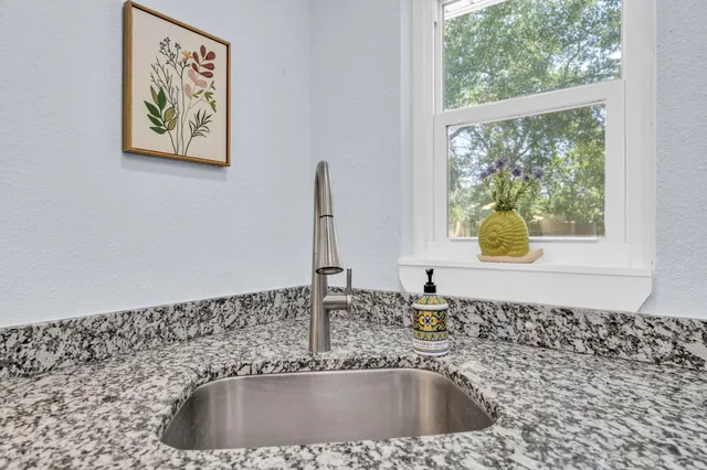 a close view of a sink and a window