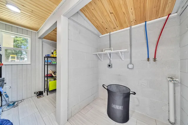 a view of a hallway with seating area