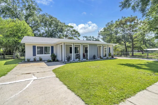 front view of a house with a swimming pool