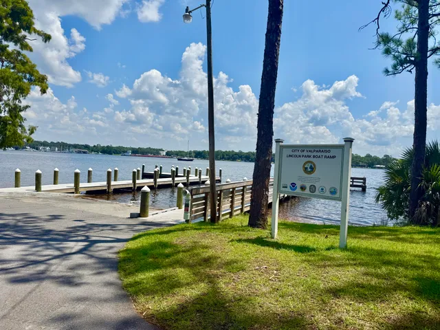 a view of a swimming pool with a yard