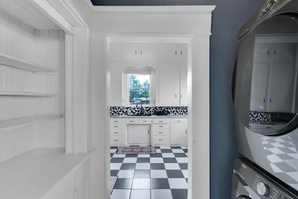 a bathroom with a bathtub and a sink