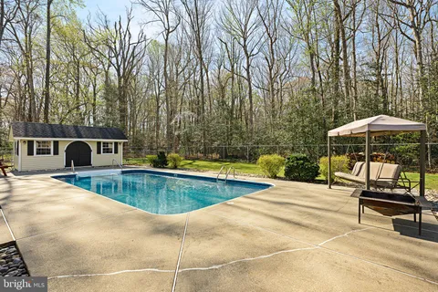 a view of a swimming pool with a lounge chairs